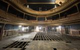 Inside the Citizens Theatre auditorium. Floor coverings starting to come up to reveal the structure under the floor.