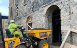 A digger entering the Citizens Theatre auditorium