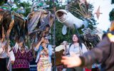 Performers holding large puppets