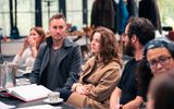A group of actors in a rehearsal room.