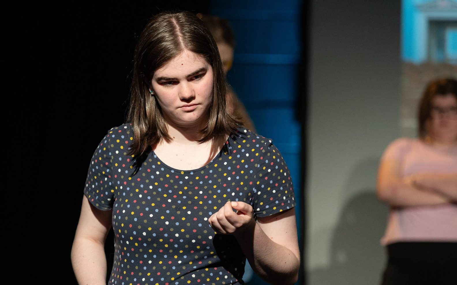 A young girl in close up mid acting