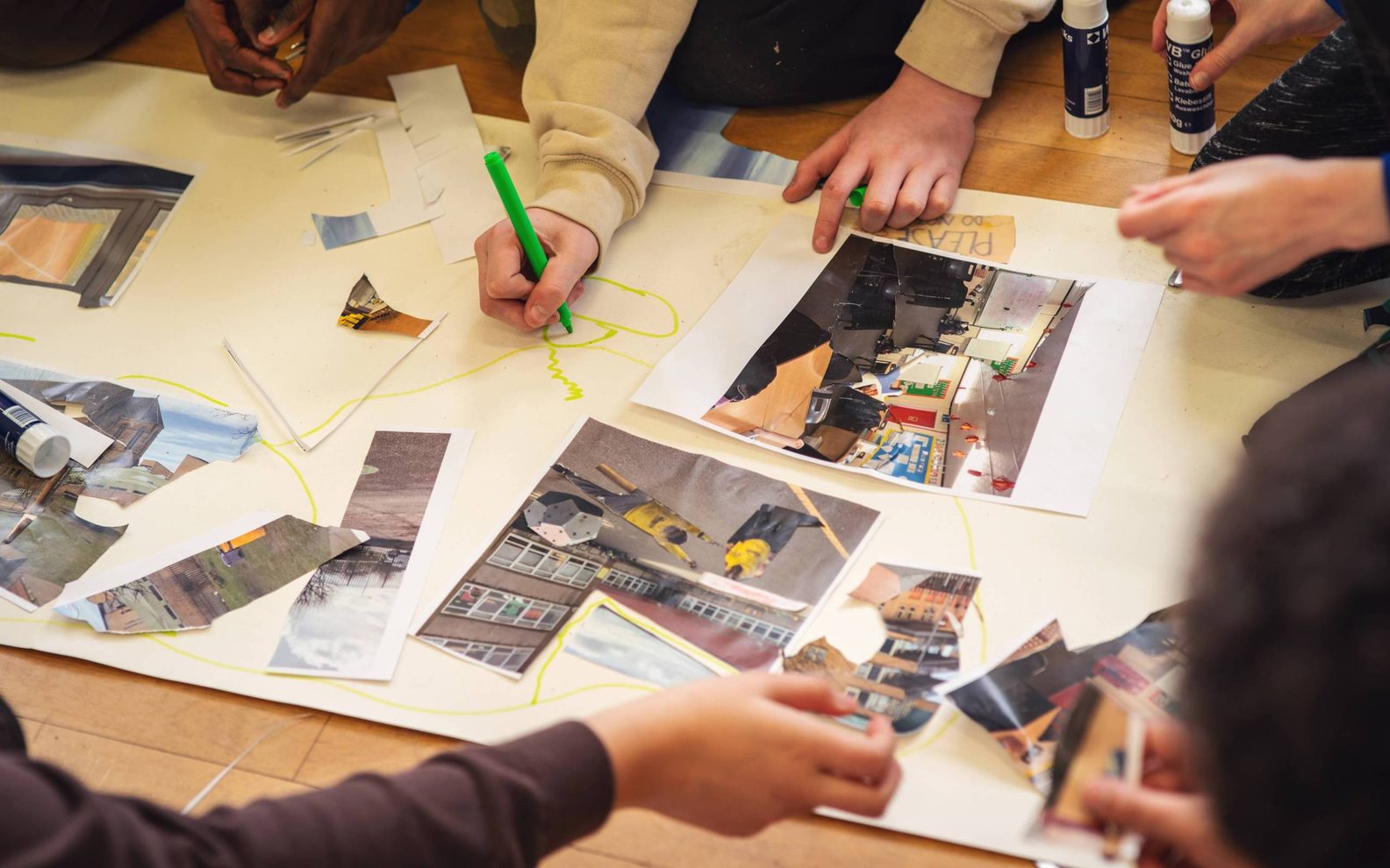 Children making a large collage.