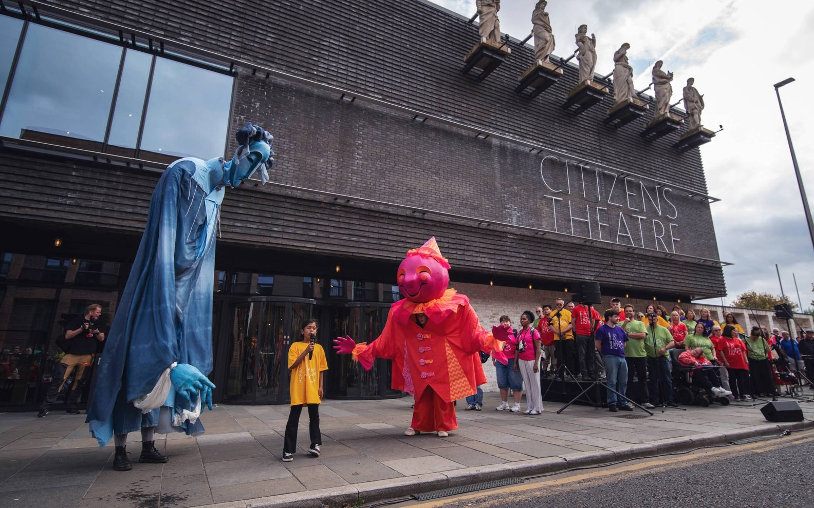 large puppets and a crowd outside the Citizens Theatre.